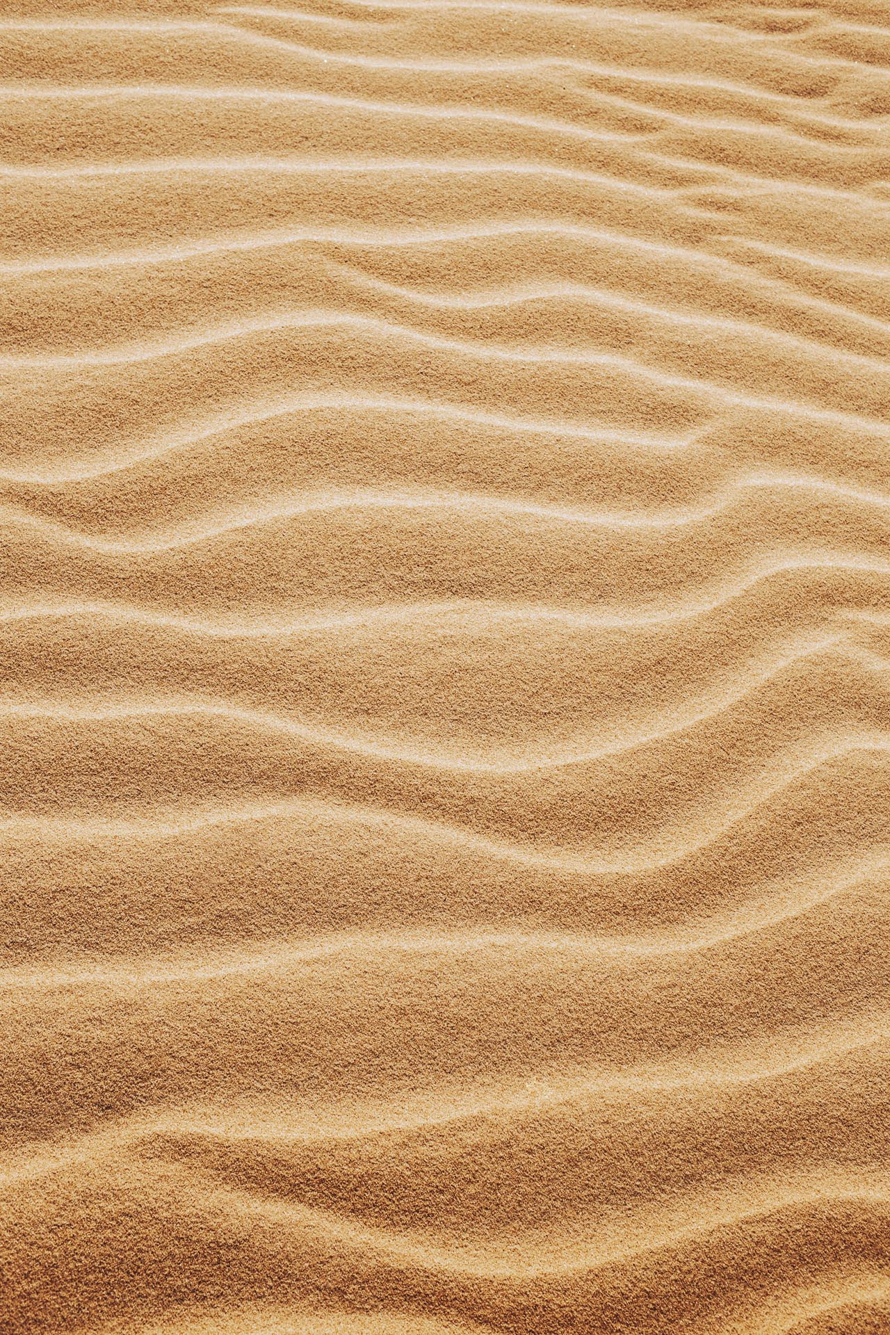 Vertical shot of the patterns on the sands in the desert